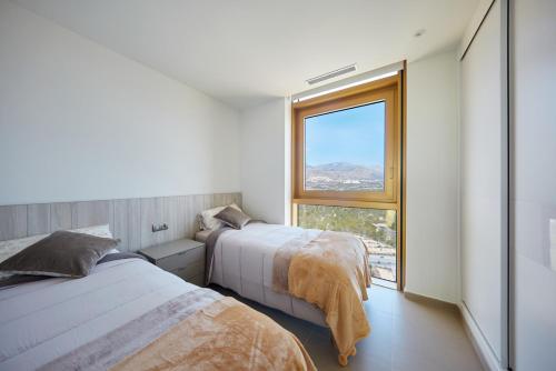 Cama o camas de una habitación en INTEMPO Sky Resort 214