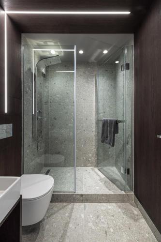 a bathroom with a glass shower and a toilet at Diamond Beach Sarafovo by KP - Luxury Collection, Apt 5 in Burgas