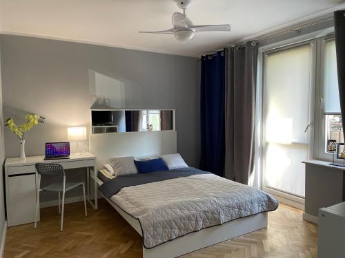 Posteľ alebo postele v izbe v ubytovaní Apartament AMSTERDAM