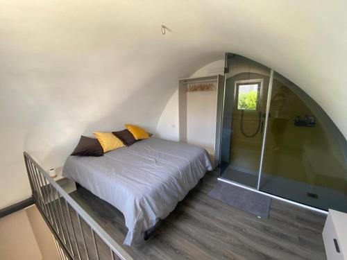 a bedroom with a bed and a walk in shower at B&b Principe18 in Noci