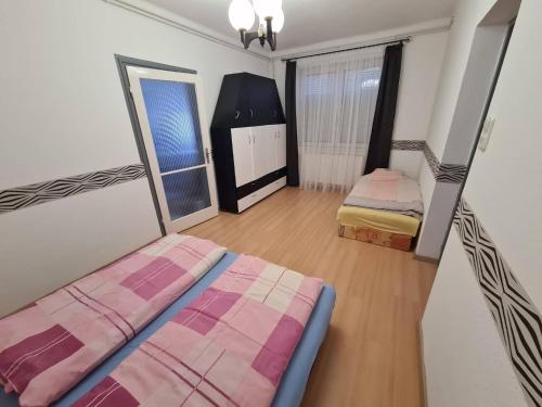Posteľ alebo postele v izbe v ubytovaní Robertó Apartman