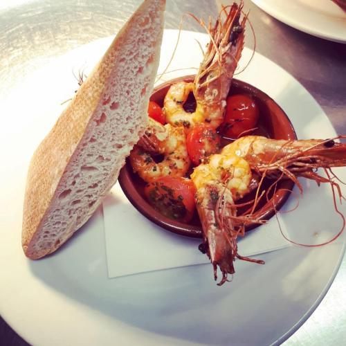 a plate of food with shrimp and a sandwich at Wellington Inn in Harrogate
