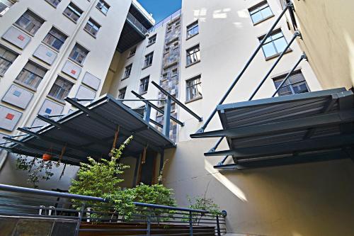 a building with a black staircase and a building at The Gold Hut in Johannesburg