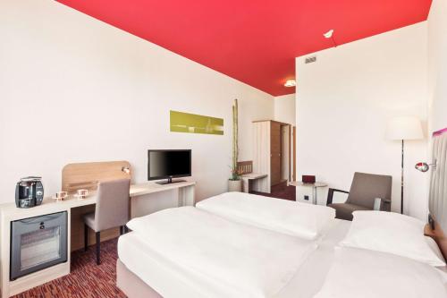 Ein Bett oder Betten in einem Zimmer der Unterkunft Park Inn by Radisson Dresden