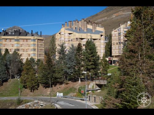 a large building on the side of a mountain at CABIROL de Alma de Nieve in Naut Aran