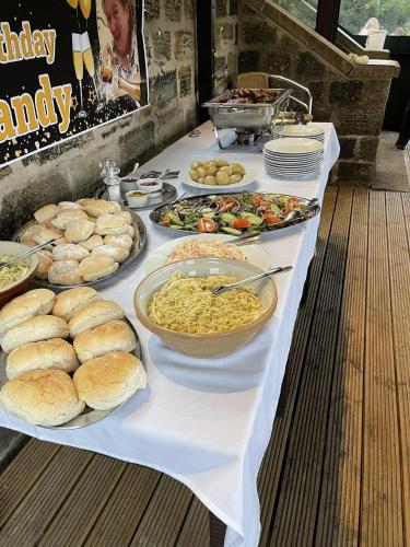 a buffet with plates of food on a table at Wellington Inn in Harrogate
