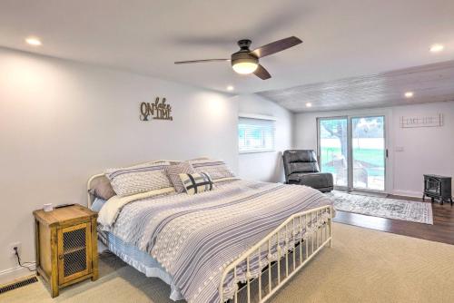 a bedroom with a bed and a ceiling fan at Cascade Lakefront Home Boat Dock, Fire Pit! in Cascade