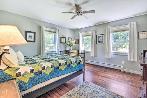 a bedroom with a bed and two windows at Sunny Morristown Home - Walk to Restaurants! in Morristown