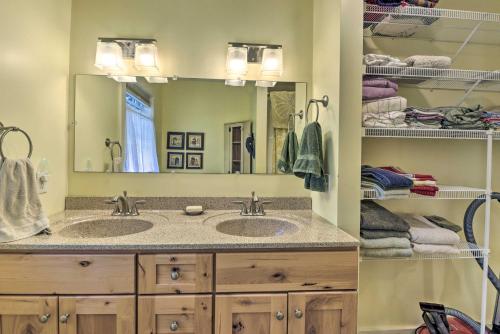 a bathroom with two sinks and a large mirror at Sunny Morristown Home - Walk to Restaurants! in Morristown