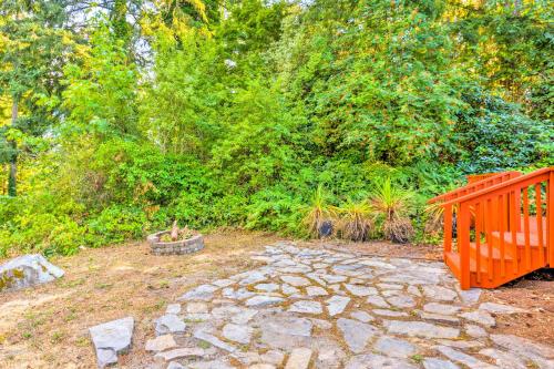 a garden with a stone path and a wooden gate at 26 Mi to Mount Rainier, Game Room Puyallup Oasis in Puyallup