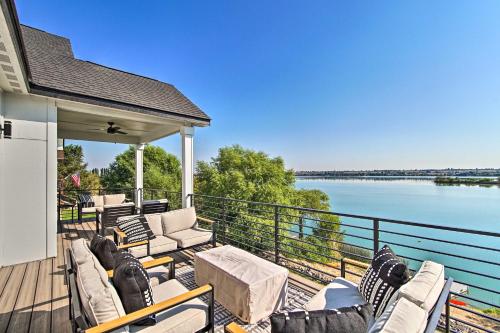 a deck with chairs and a view of the water at Picturesque Moses Lake House with Boating Dock in Moses Lake