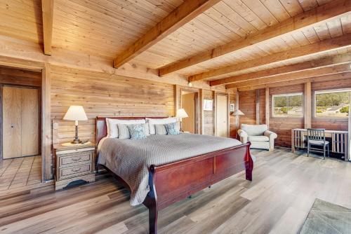 a bedroom with a bed in a log cabin at Shell Beach in Sea Ranch