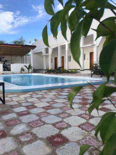 Der Swimmingpool an oder in der Nähe von Hôtel Camille