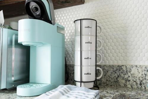 a kitchen counter with a coffee maker on it at Casa Limonada Boutique Motel in Sarasota