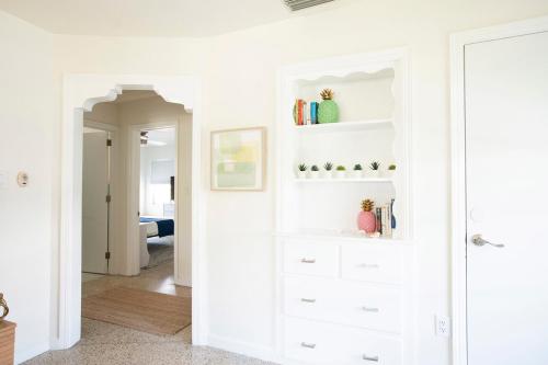 a room with white walls and white shelves at Casa Limonada Boutique Motel in Sarasota