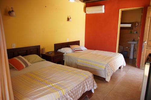 Postel nebo postele na pokoji v ubytování Hotel Punta Rusia