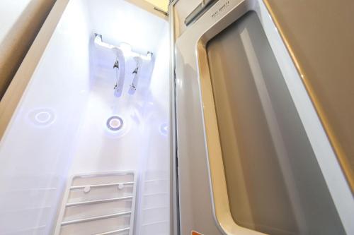 an empty refrigerator in an airplane at Masan First Class Hotel in Changwon