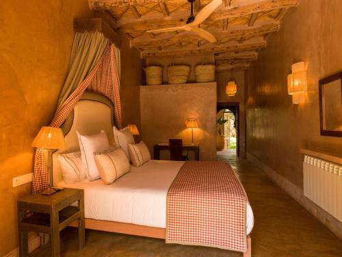 a bedroom with a bed in a room at CASA ABRACADABRA in Marrakech