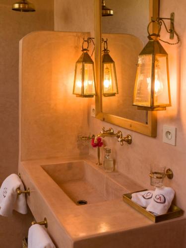 a bathroom with a large sink and a mirror at CASA ABRACADABRA in Marrakech
