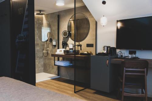 a bathroom with a shower and a sink and a mirror at Roannay - Francorchamps in Francorchamps