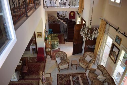 an overhead view of a living room with chairs at Private Villa AKOBARA, 2km from city center in Corfu Town