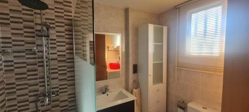 a bathroom with a sink and a shower at Apartments Varadero in Salou