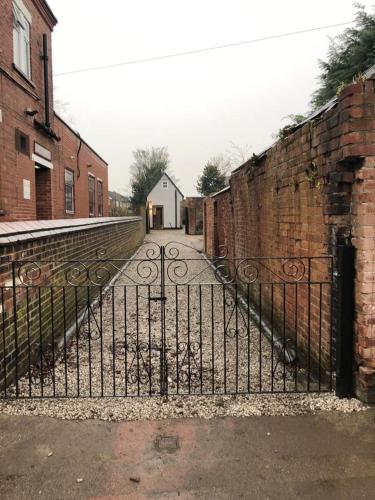 a gate to an alley with a brick wall at The Little Hexthorpe house in Doncaster