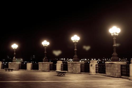 a row of street lights in a park at night at Casa Flora in Taranto