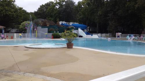 an empty swimming pool with a water park at Mobil home 4-6 places St brėvin les pins 44 in Saint-Brevin-les-Pins