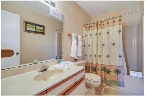 a bathroom with a sink and a toilet and a shower at New listing!!! 4 min walk to the beach! in Destin