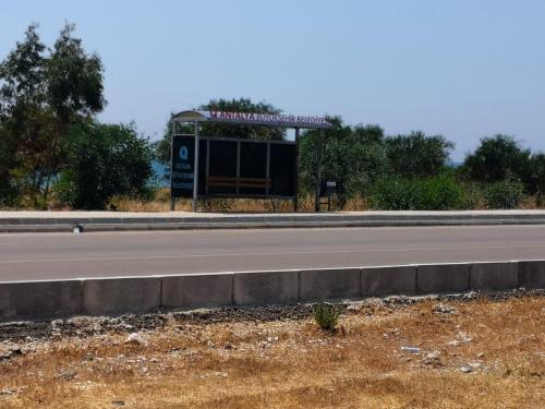 a highway with a sign on the side of a road at Ferienwohnung in Finike, 150 Meter vom Meer entfernt 3 in Finike