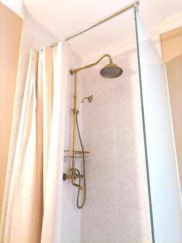 a shower in a bathroom with a shower curtain at CASA BELGERI - Bed & Breakfast in Dongio