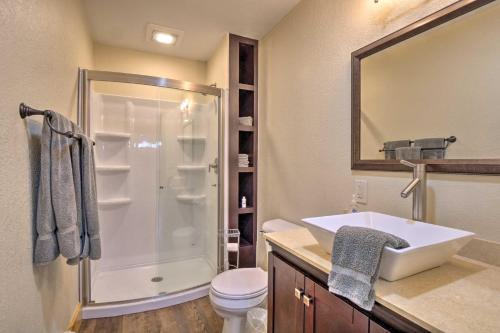 a bathroom with a white sink and a shower at Breathtaking Lake-View Retreat with On-Site Hiking! in Twin Lakes