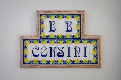 a sign that says b central on a wall at B&B Corsini in Bologna