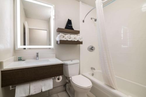 a bathroom with a sink and a toilet and a shower at Best Western Plymouth Inn-White Mountains in Campton