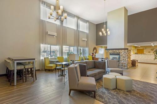 a living room with a couch and chairs and a fireplace at Best Western Plus Wenatchee Downtown Hotel in Wenatchee