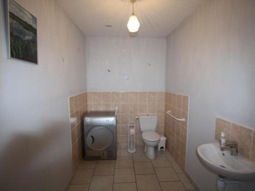 a bathroom with a toilet and a sink at Gîte spacieux avec grande terrasse, proche de Gérardmer - Idéal familles et groupes - FR-1-589-420 in Docelles