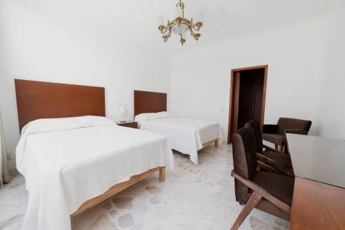 Postel nebo postele na pokoji v ubytování Violeta Hotel Boutique