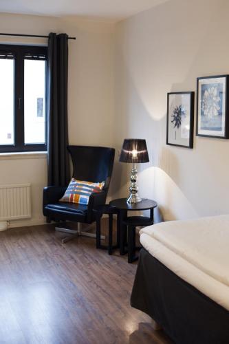 Ένα ή περισσότερα κρεβάτια σε δωμάτιο στο Centralhotellet