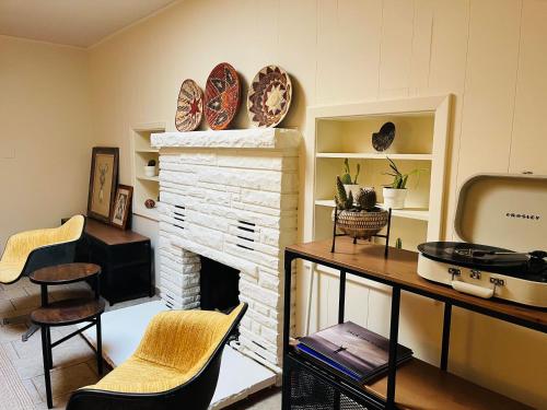 a living room with a fireplace and a table and chairs at Star Motel in Sedona
