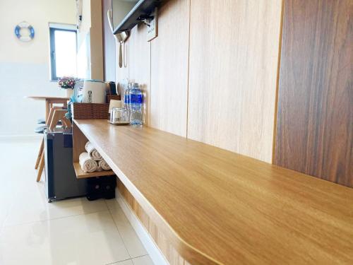 a kitchen with a wooden counter top in a room at Thiên Hải 2 Hotel in Quy Nhon