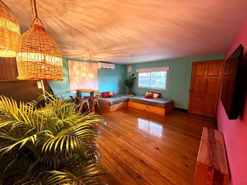 a living room with a couch and a table at Be Happy Hotel in San Andrés