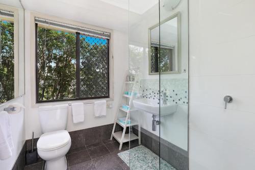 a bathroom with a toilet and a sink and a shower at NAROO7- PRIME, CENTRE OF MOOLOOLABA LOCATION in Mooloolaba