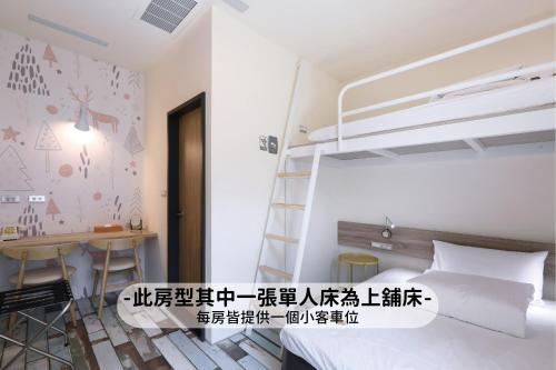 Ein Bett oder Betten in einem Zimmer der Unterkunft MINI HOTELS (Taichung Station Branch)