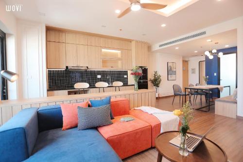 a living room with a couch and a kitchen at Glese Balcony Seaview Apartment - FLC Sea Tower Quy Nhon in Quy Nhon