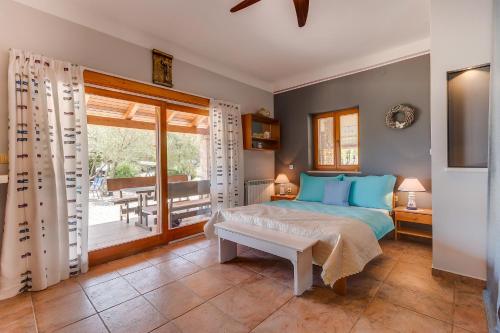a bedroom with a bed and a balcony at Seaside holiday house Artatore, Losinj - 17102 in Čunski