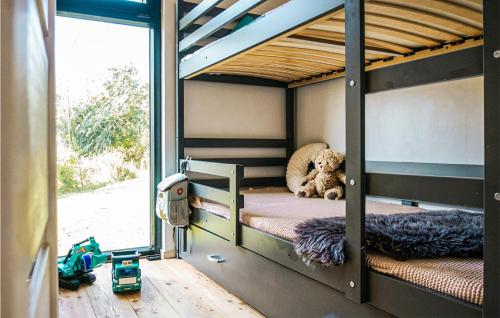 a bedroom with a bunk bed with a teddy bear on it at Stunning Home In Rydzewo With Kitchen in Rydzewo