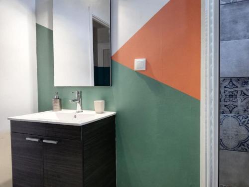 a bathroom with a sink and a mirror at AS Monastiraki Apartment 1B in Athens