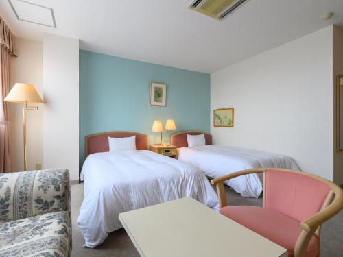 Postel nebo postele na pokoji v ubytování Tabist Katahara Resort Gamagori
