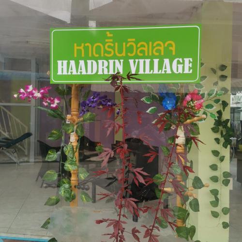 a sign in the window of a store at Haadrin village Fullmoon in Haad Rin
